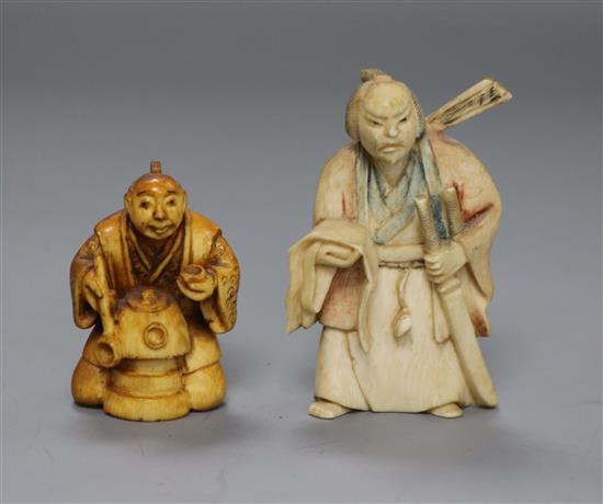 Two Japanese ivory netsuke of a Samurai and a man with a pot (530, 552)